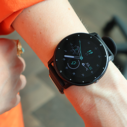 Person wearing the OmniWatch, ready to monitor health and fitness activities